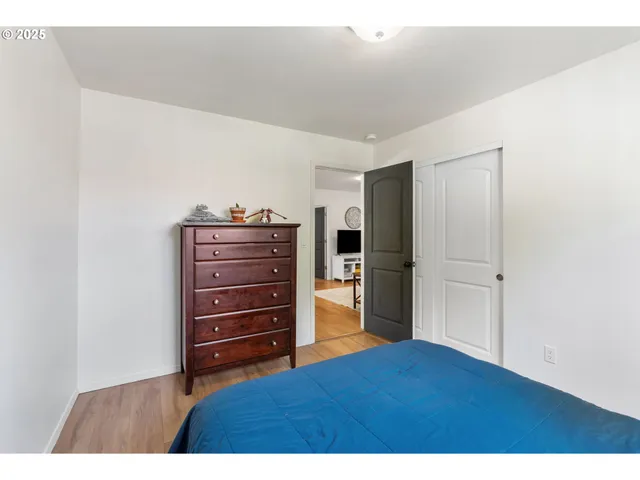 a room with a dresser and a mirror