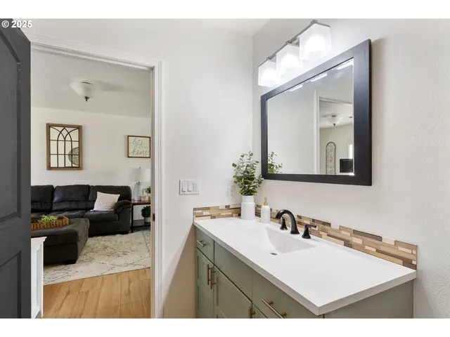 a bathroom with a sink and a mirror