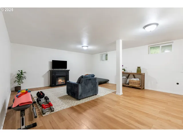 a bedroom with furniture and a flat screen tv
