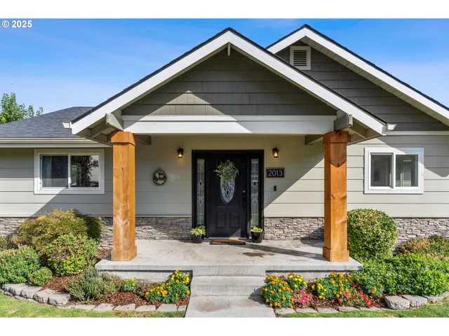 a front view of a house with garden