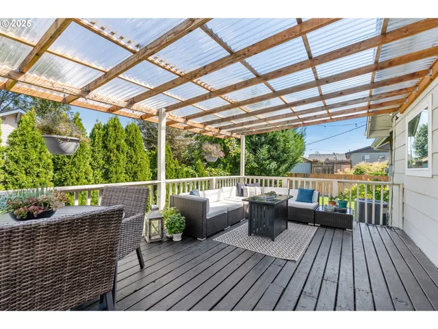 a view of balcony with couch and wooden floor