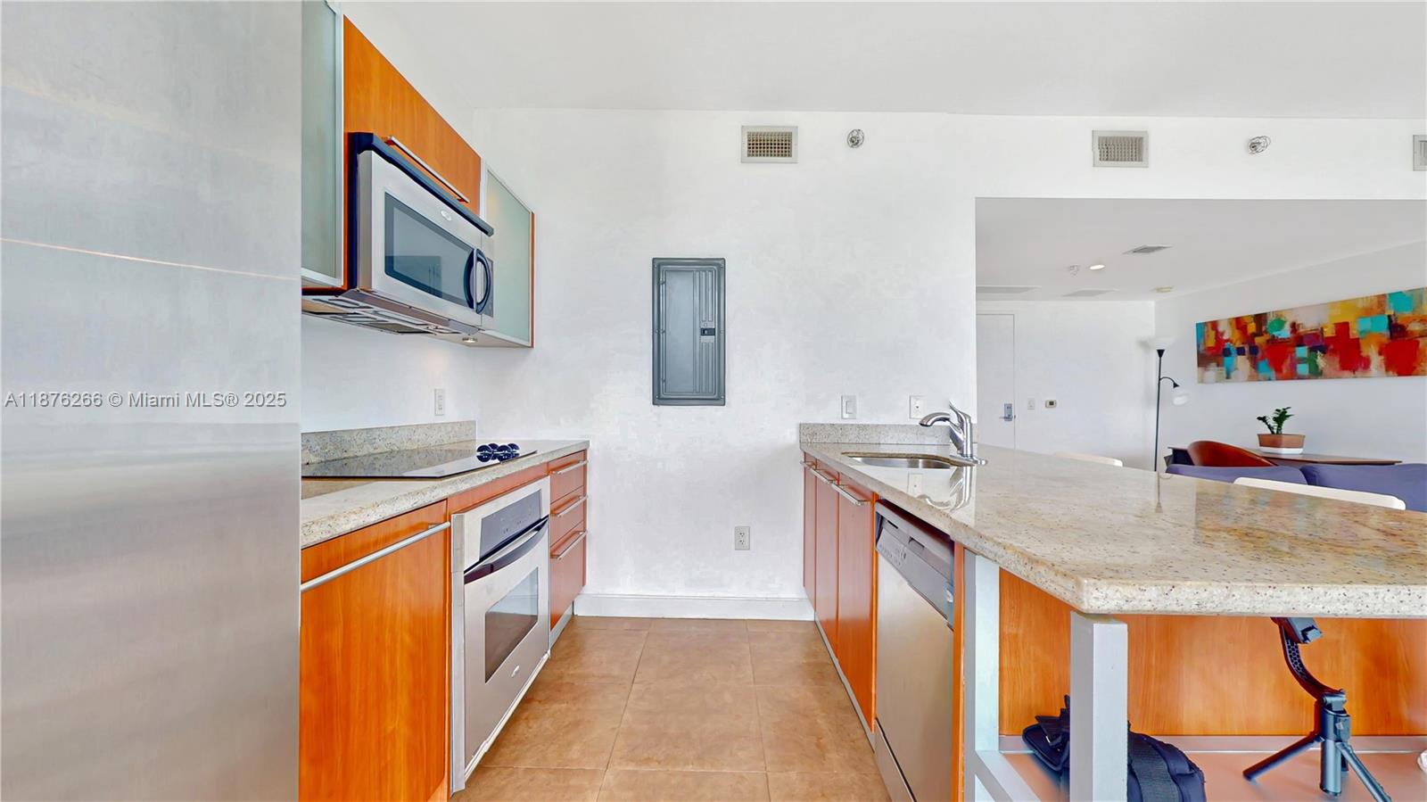 185 Southwest 7th Street, Unit 2900 Miami, FL 33130 - Photo 7 of 25 a kitchen with stainless steel appliances granite countertop a sink and a stove