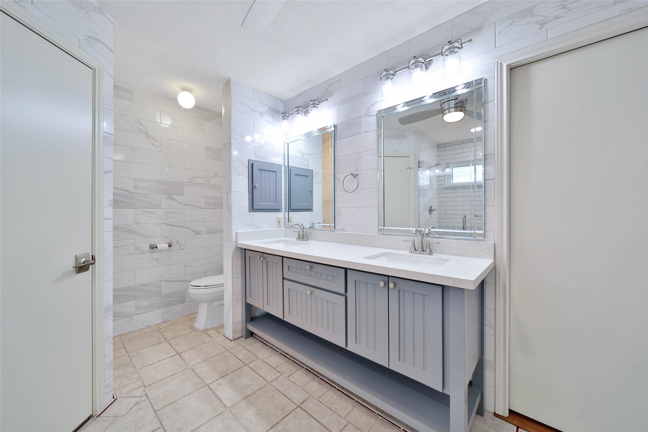 5010 Cupids Bower Court Spring, TX 77388 - Photo 17 of 40 a bathroom with a double vanity sink mirror and shower