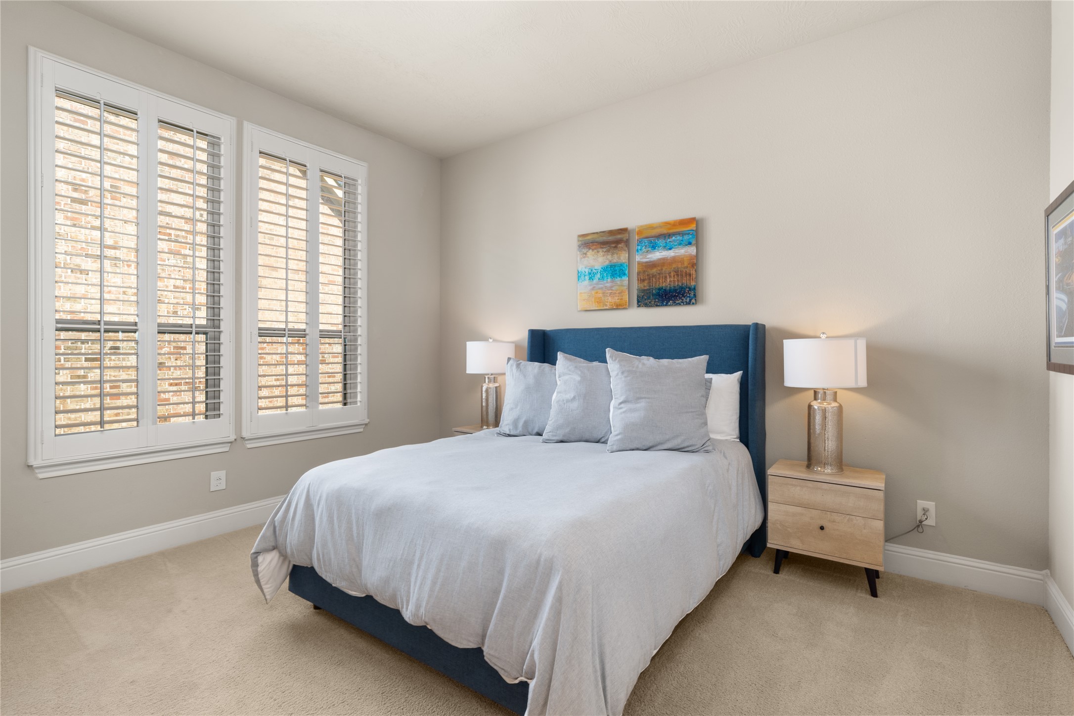 19813 Cullen Ridge Drive Porter, TX 77365 - Photo 33 of 44 Discover a serene haven in Bedroom 2, featuring abundant natural light, stylish decor, and inviting comfort perfect for relaxation.