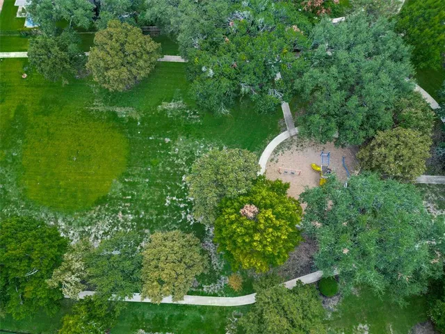 a view of a garden with a swimming pool