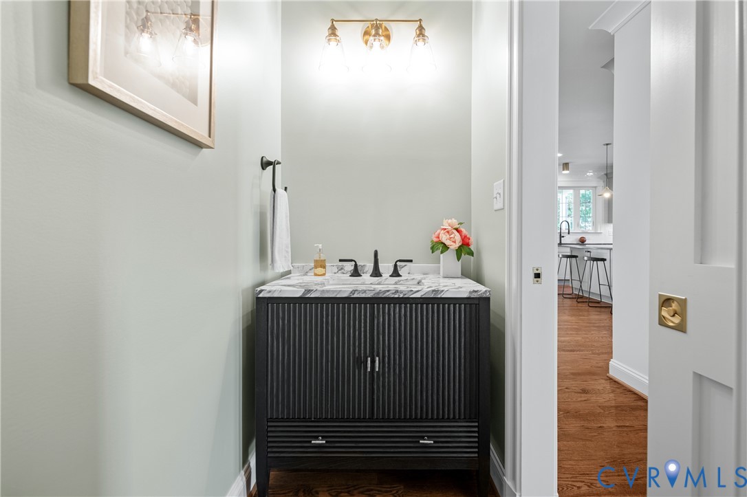 4705 Fitzhugh Avenue Richmond, VA 23230 - Photo 22 of 50 a bathroom with a sink and a mirror