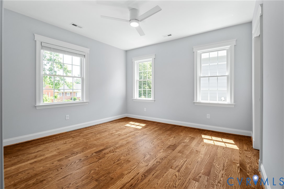 4705 Fitzhugh Avenue Richmond, VA 23230 - Photo 33 of 50 a view of an empty room with wooden floor and a window