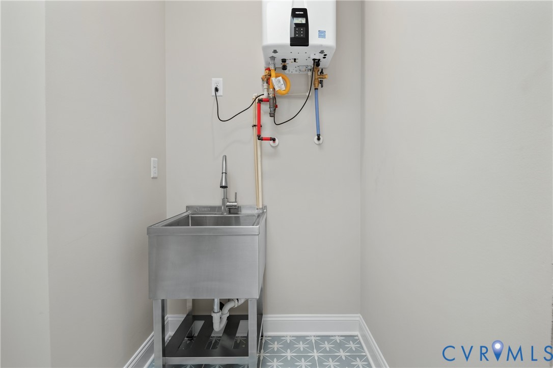 4705 Fitzhugh Avenue Richmond, VA 23230 - Photo 45 of 50 a view of a storage & utility room with a sink