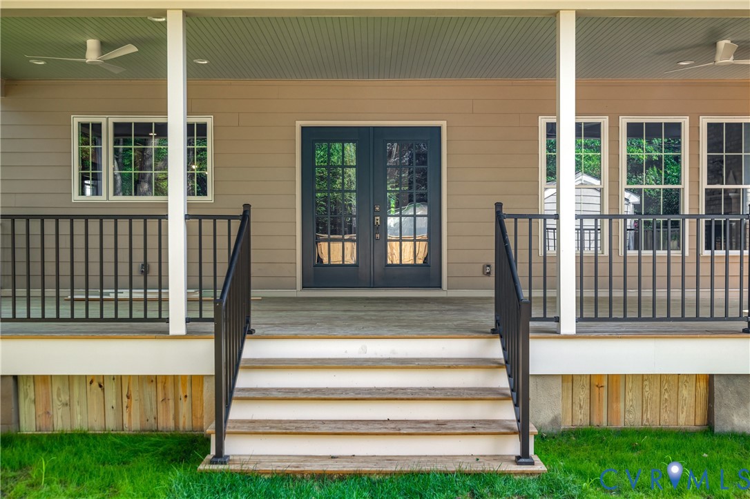 4705 Fitzhugh Avenue Richmond, VA 23230 - Photo 48 of 50 a view of a house with a small yard and wooden floor and fence