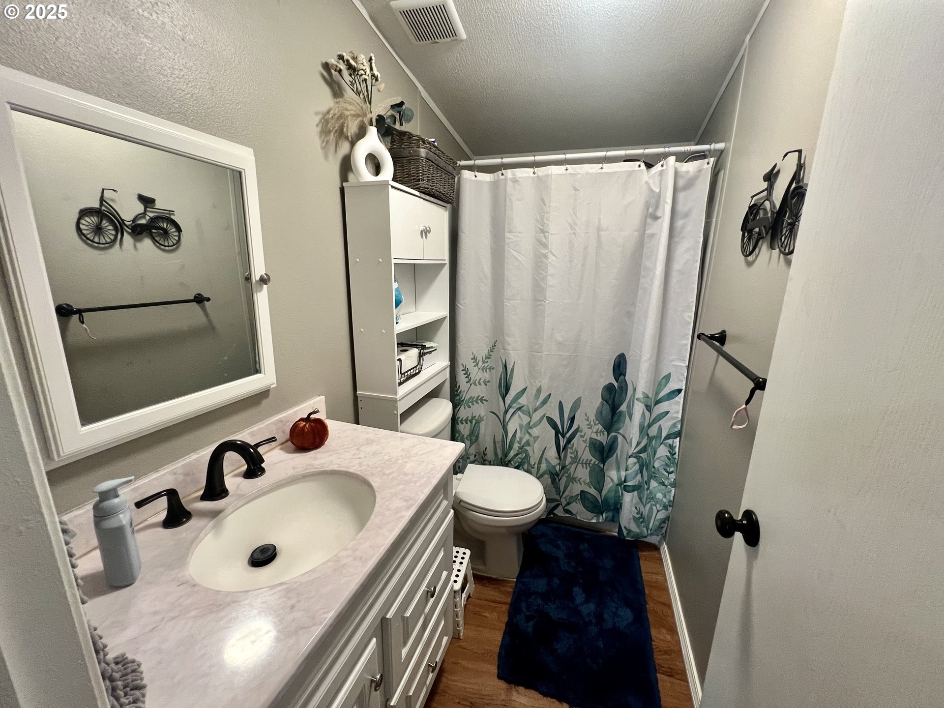 548 Pioneer Court Union, OR 97883 - Photo 15 of 18 a bathroom with a sink and mirror with toilet