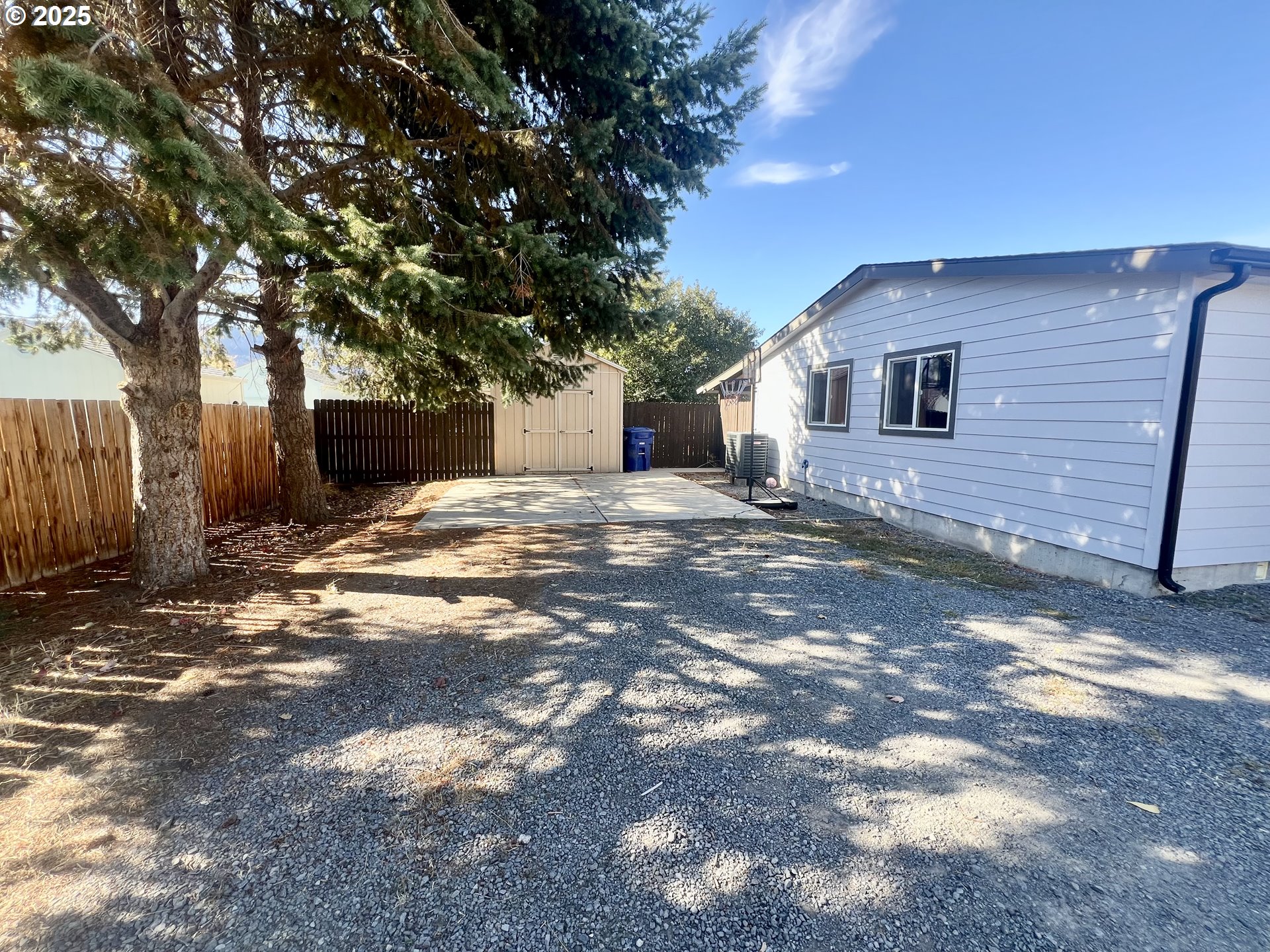 548 Pioneer Court Union, OR 97883 - Photo 2 of 18 a view of a grey house with a yard