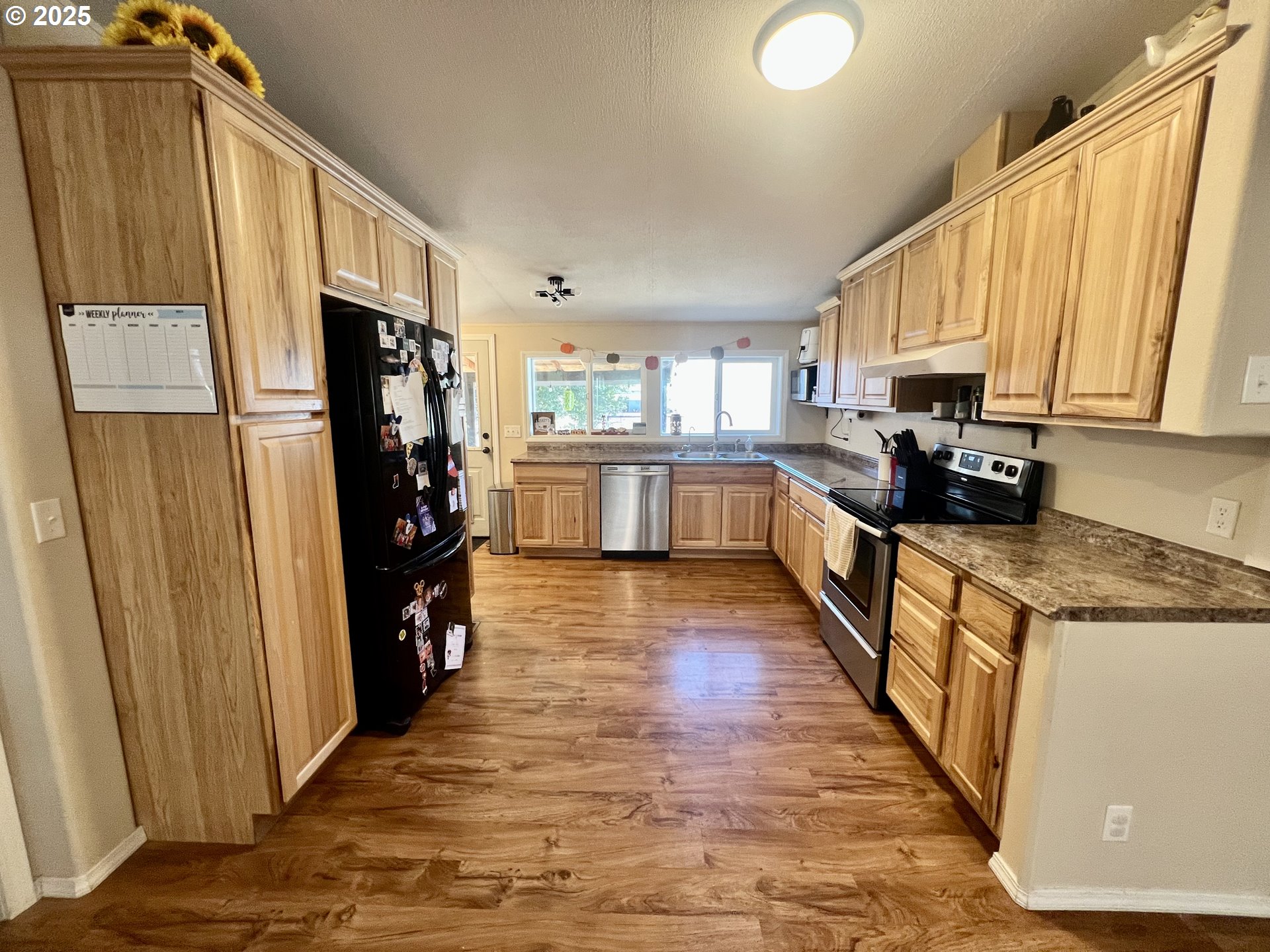 548 Pioneer Court Union, OR 97883 - Photo 5 of 18 a kitchen with stainless steel appliances a refrigerator sink and cabinets