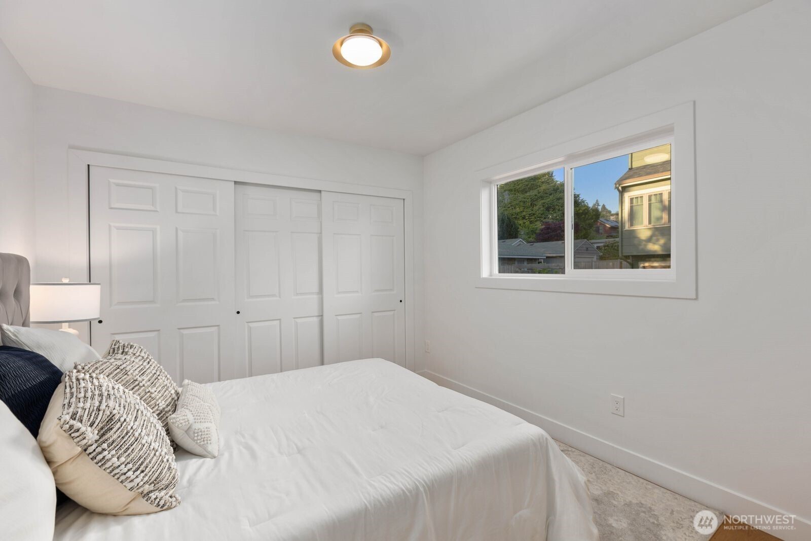 512 Northwest 44th Street Seattle, WA 98107 - Photo 16 of 37 a bedroom with a bed and a window