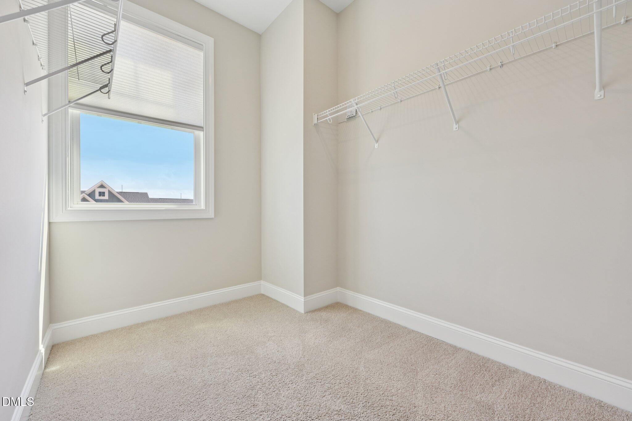 8405 Zinc Autumn Path Raleigh, NC 27615 - Photo 13 of 24 a view of an empty room with a window