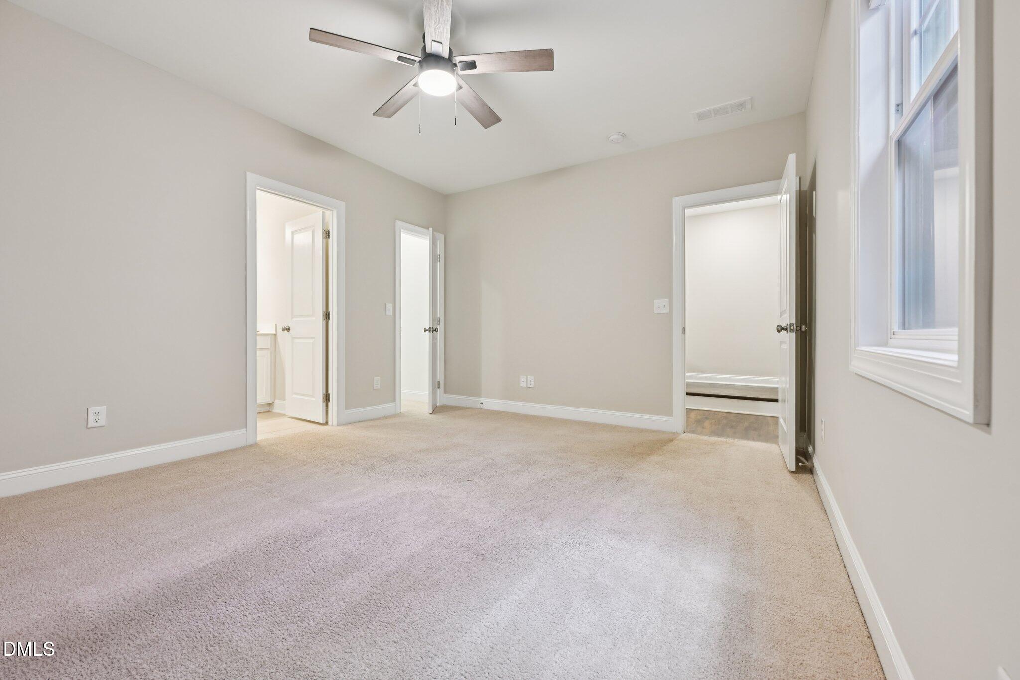 8405 Zinc Autumn Path Raleigh, NC 27615 - Photo 15 of 24 a view of an empty room with a window