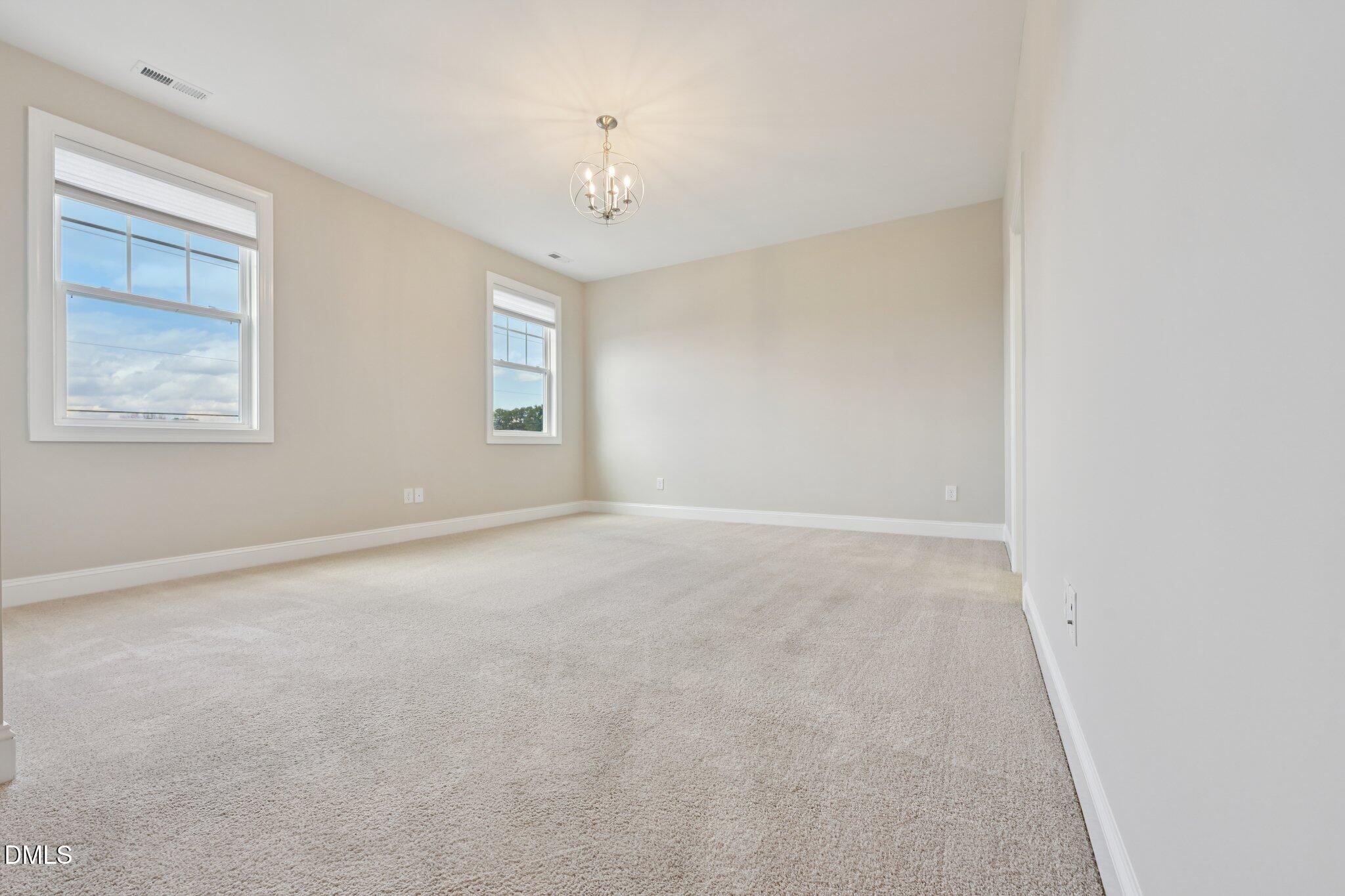 8405 Zinc Autumn Path Raleigh, NC 27615 - Photo 18 of 24 a view of an empty room with a window