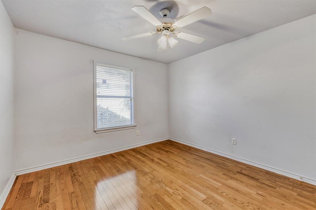 2617 Hereford Road Denton, TX 76210 - Photo 20 of 27 wooden floor in an empty room with a window