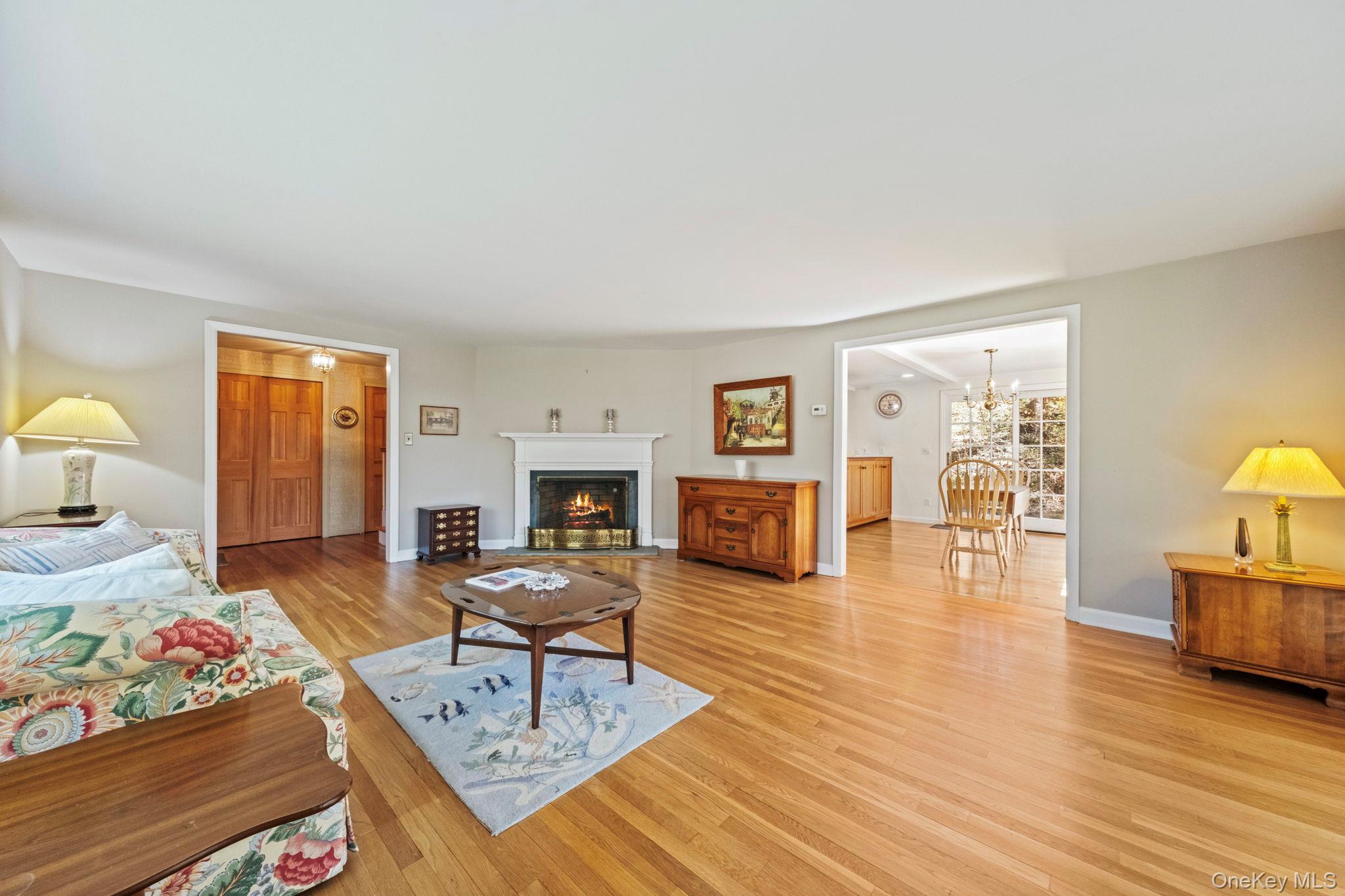 12 Harris Road Katonah, NY 10536 - Photo 12 of 38 a living room with furniture and a wooden floor