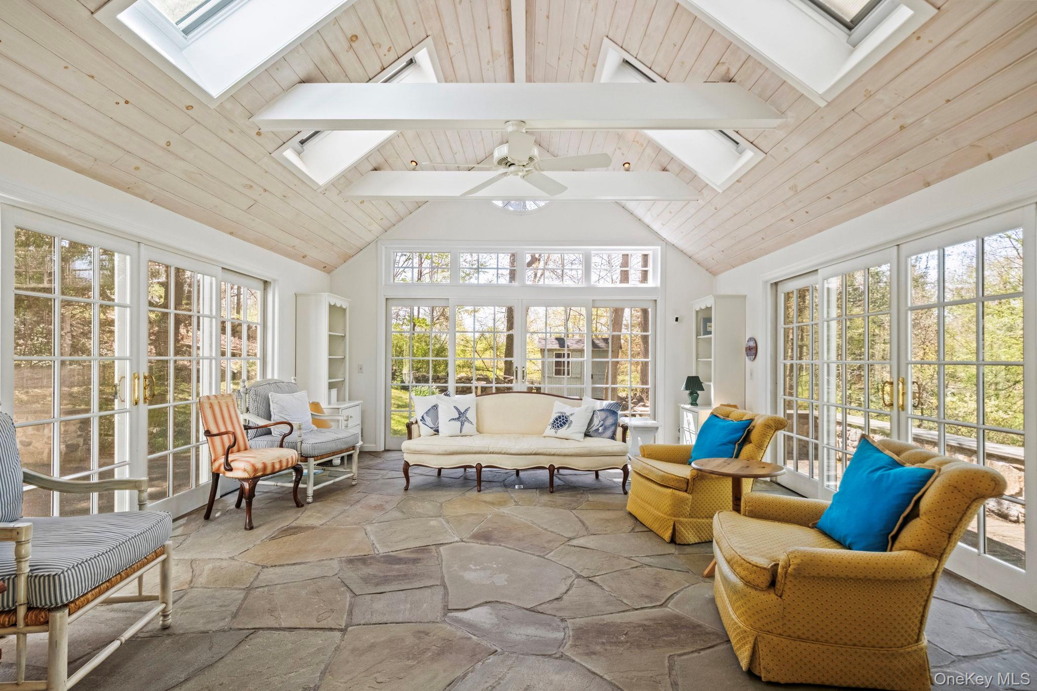 12 Harris Road Katonah, NY 10536 - Photo 2 of 38 a living room with furniture and large windows