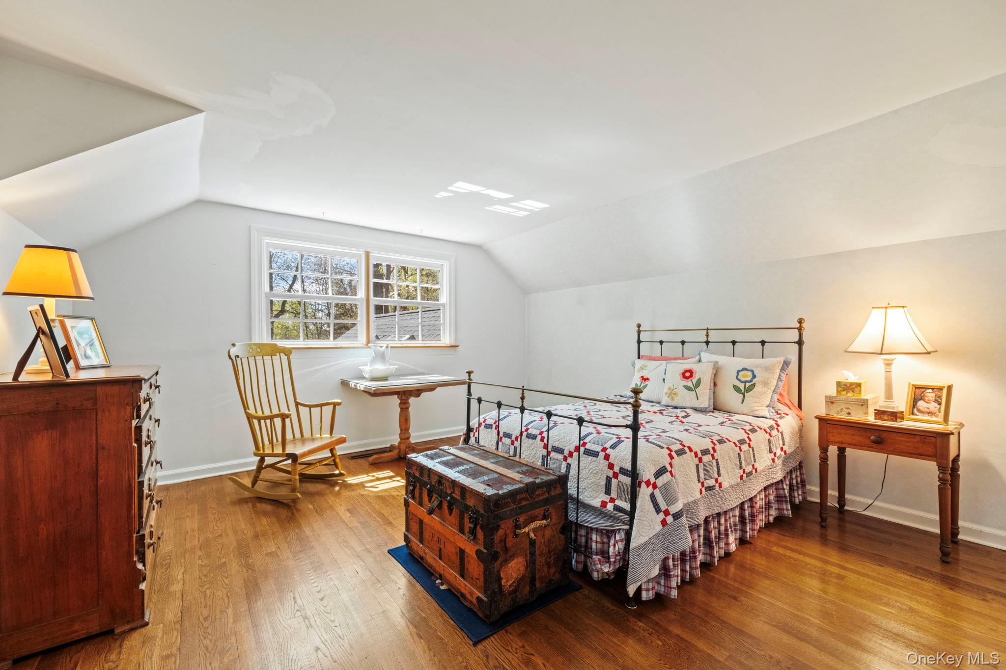 12 Harris Road Katonah, NY 10536 - Photo 23 of 38 a bedroom with a bed and a table in it