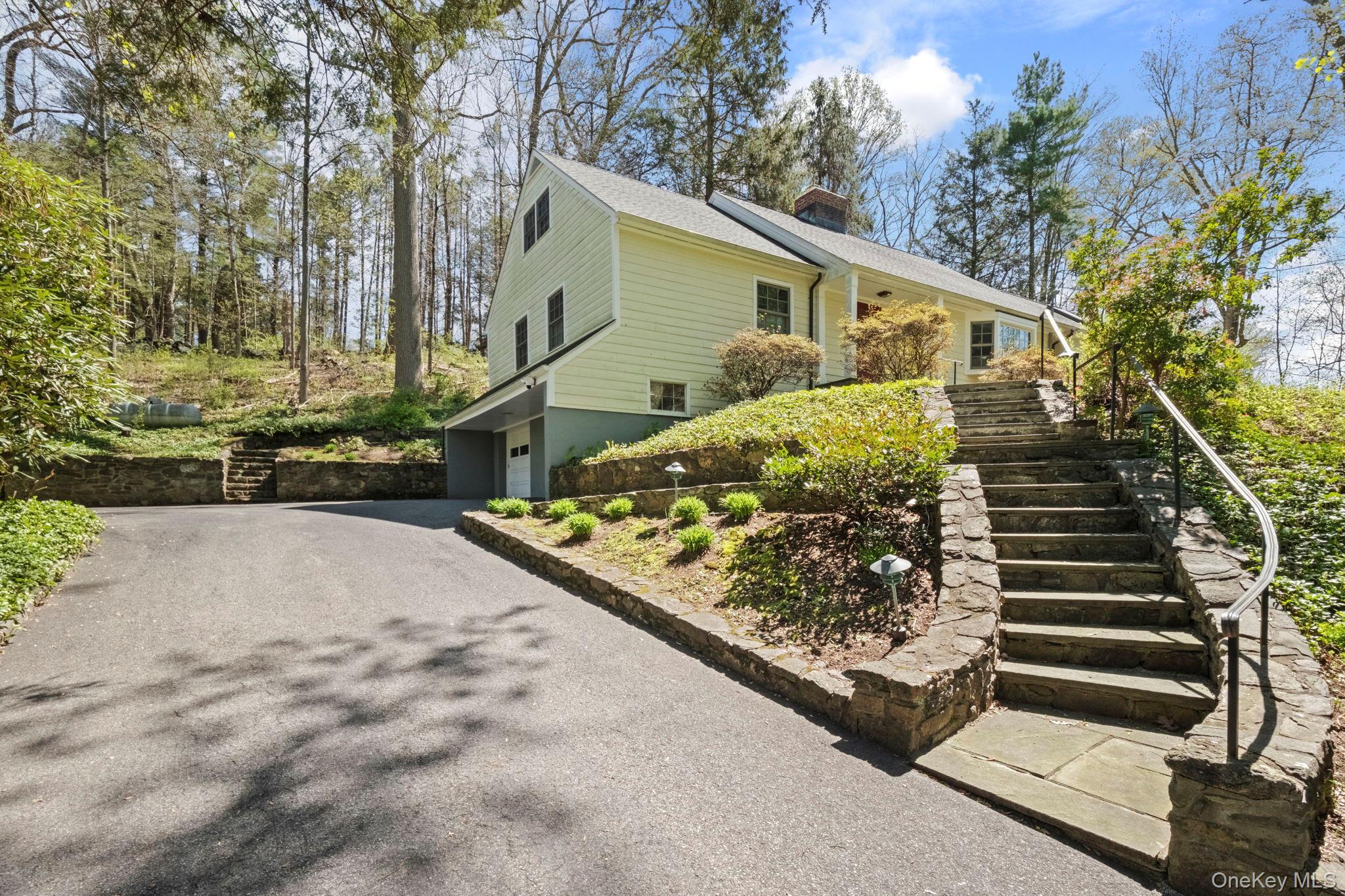 12 Harris Road Katonah, NY 10536 - Photo 28 of 38 a view of a house with a yard and wooden fence