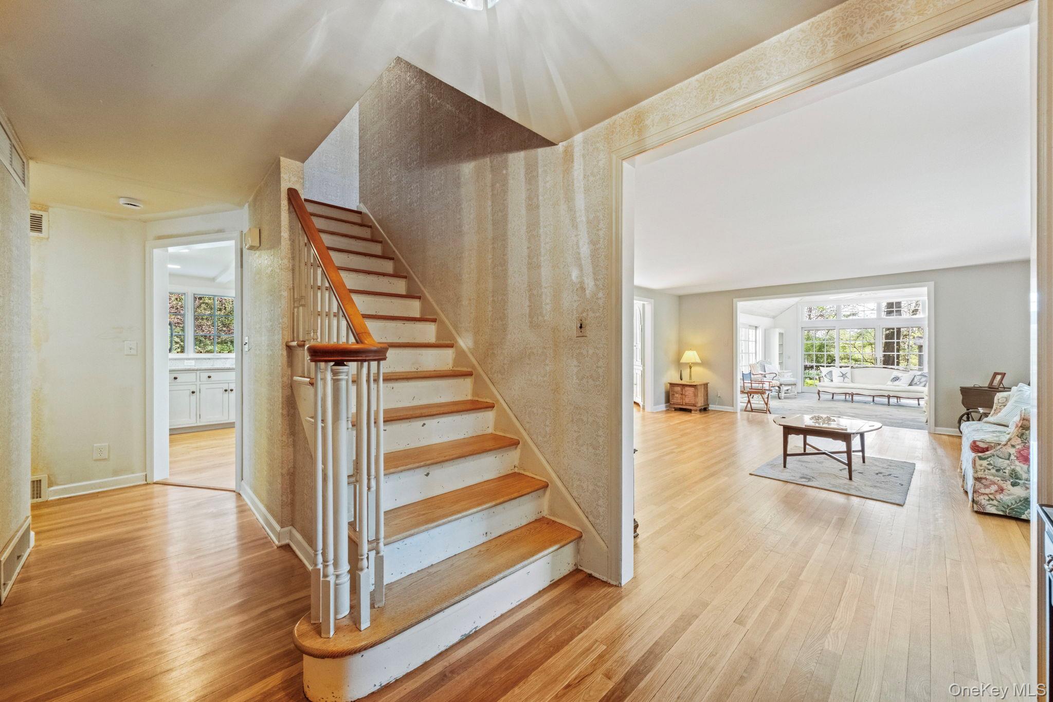 12 Harris Road Katonah, NY 10536 - Photo 29 of 38 a view of a room with wooden floor and stairs
