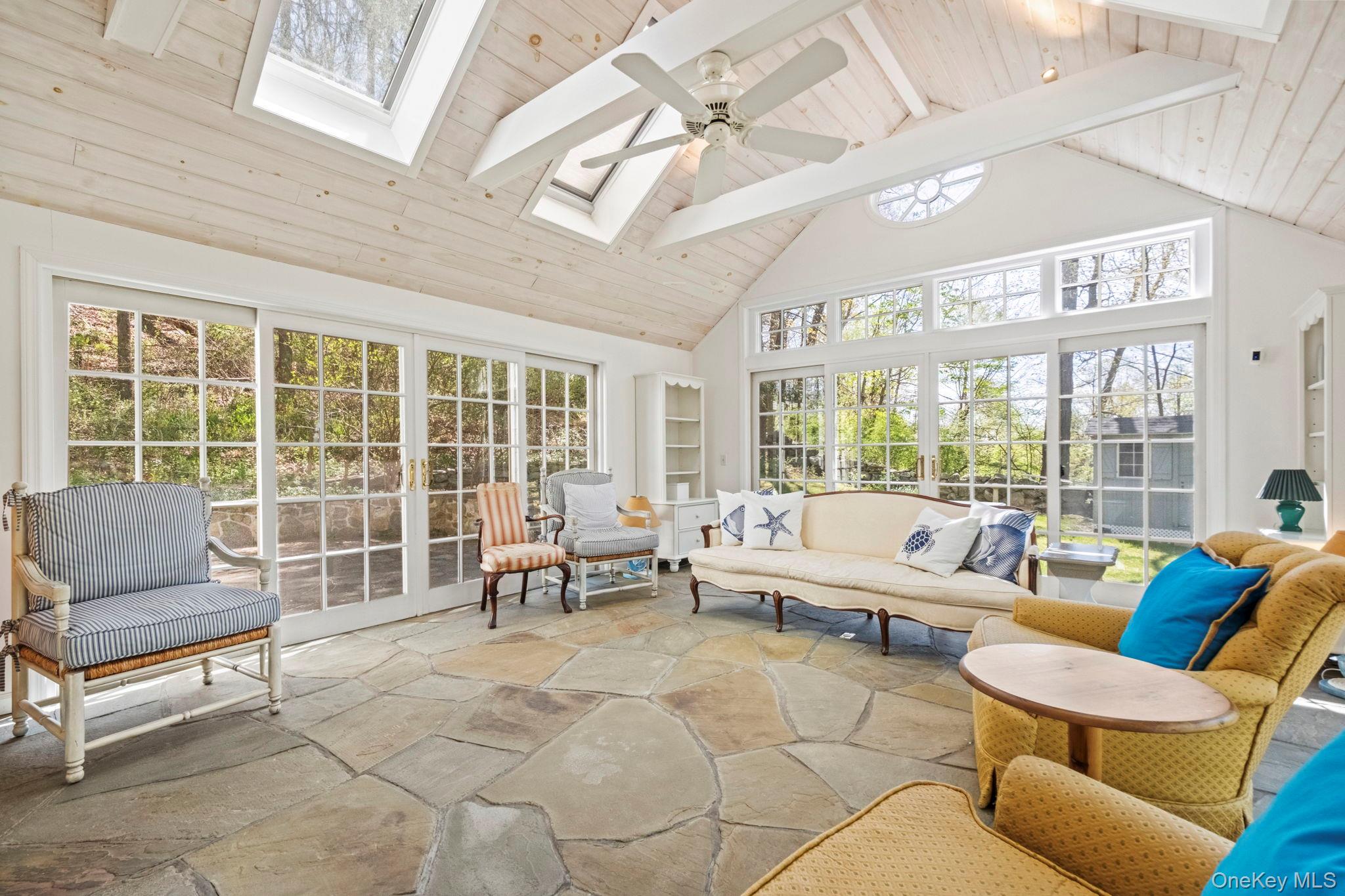 12 Harris Road Katonah, NY 10536 - Photo 3 of 38 a living room with furniture and a large window