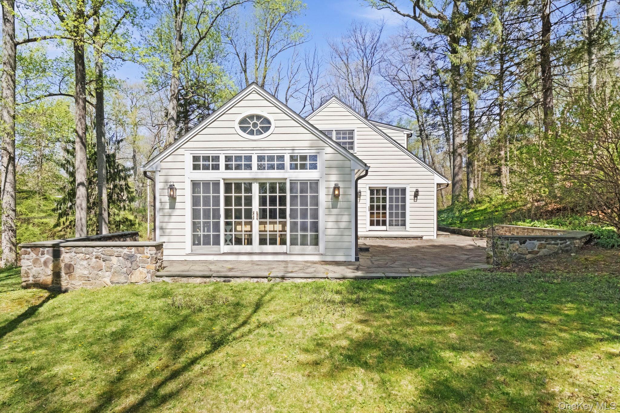 12 Harris Road Katonah, NY 10536 - Photo 33 of 38 a view of a house with a yard and sitting area