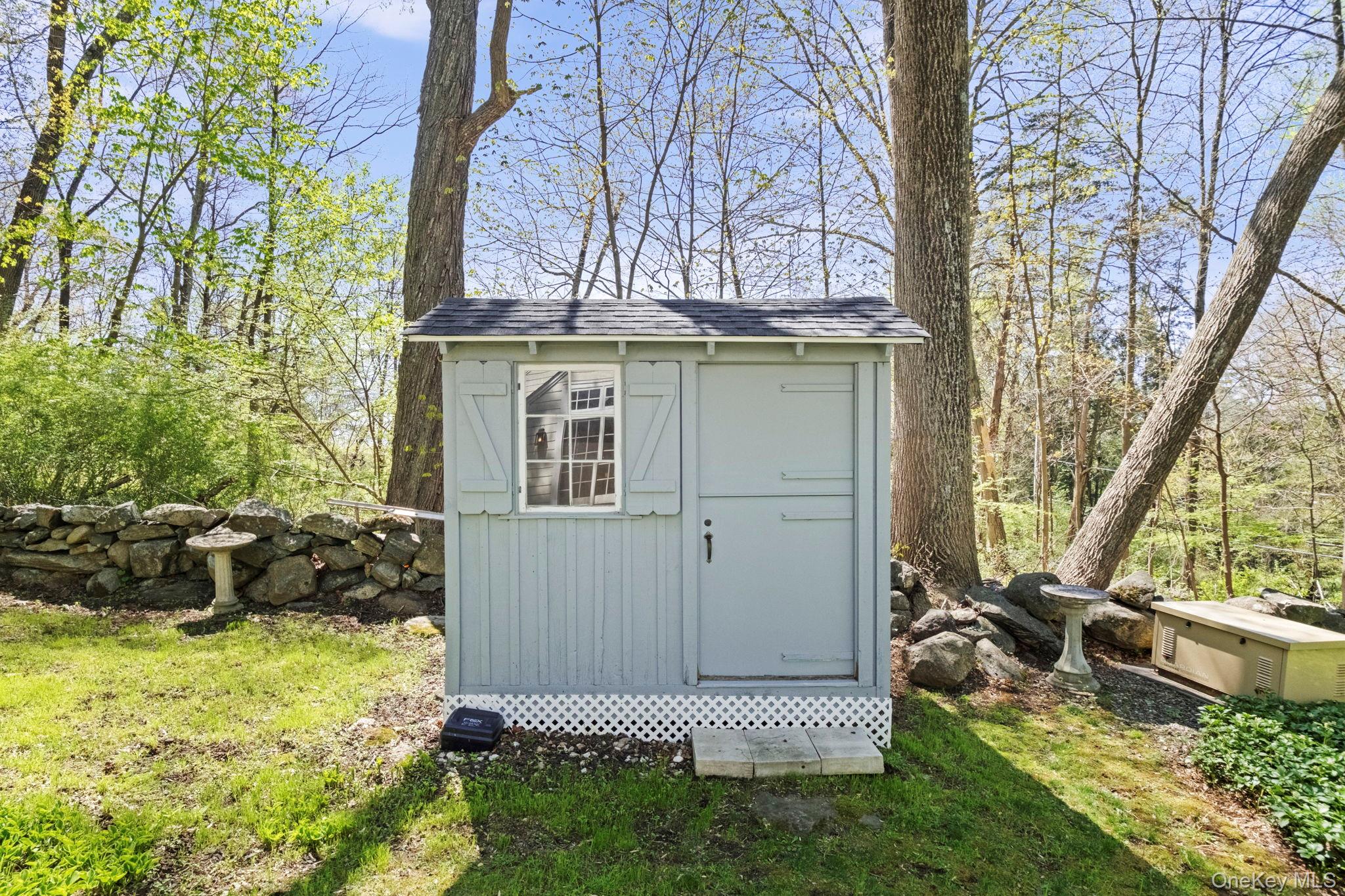 12 Harris Road Katonah, NY 10536 - Photo 34 of 38 a view of a backyard of the house