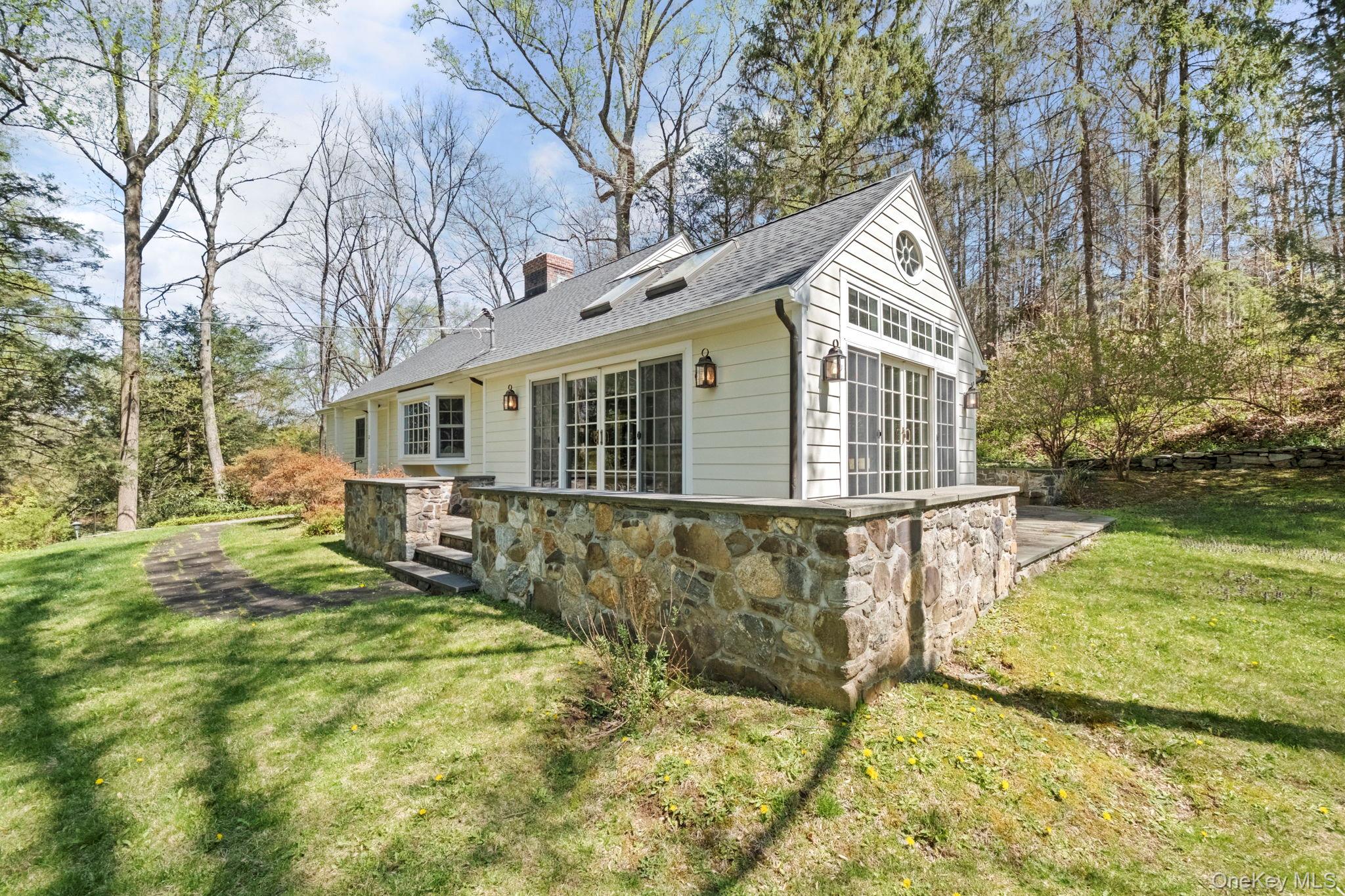 12 Harris Road Katonah, NY 10536 - Photo 35 of 38 a view of a house with a yard