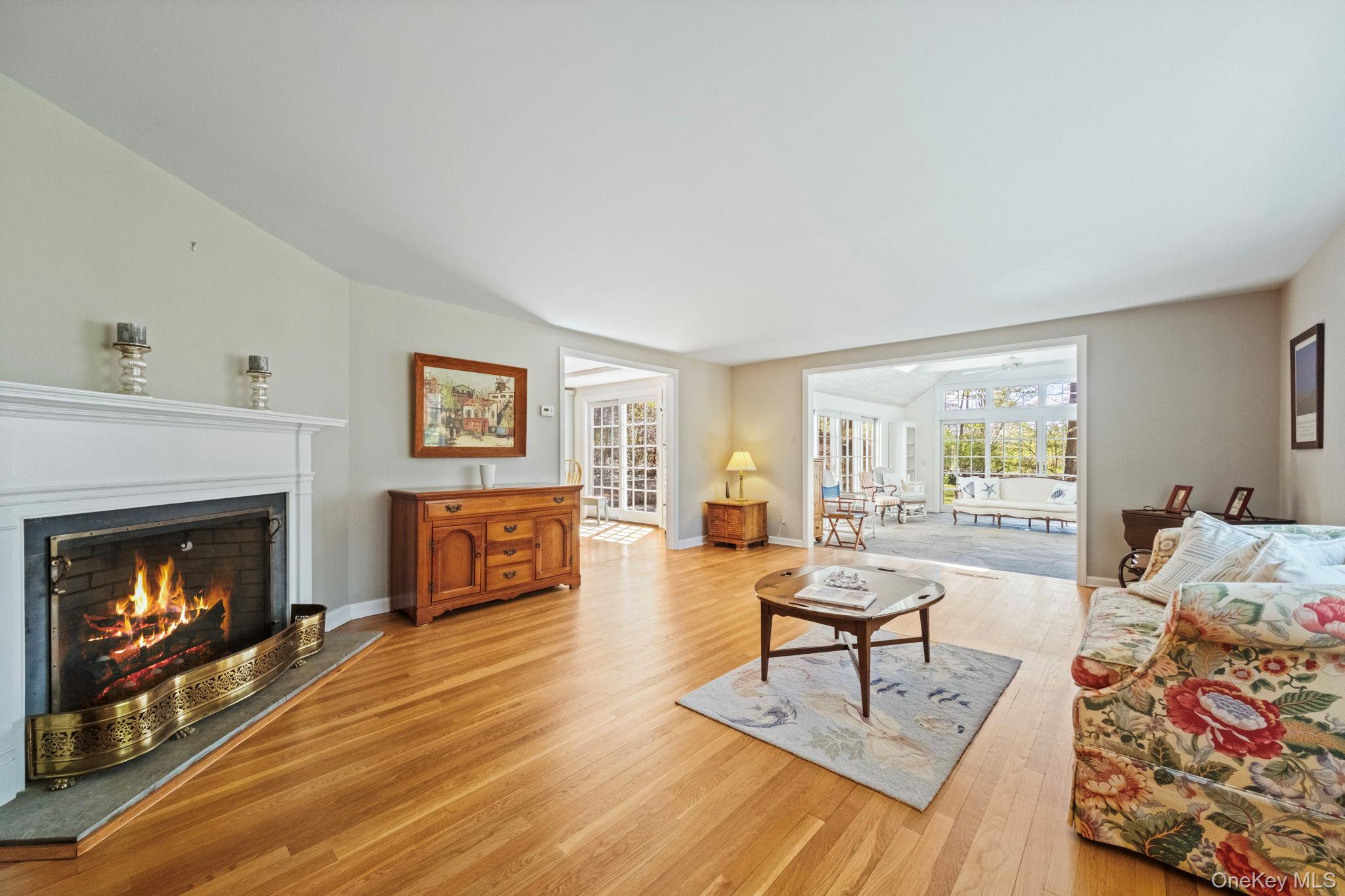 12 Harris Road Katonah, NY 10536 - Photo 9 of 38 a living room with furniture and a fireplace