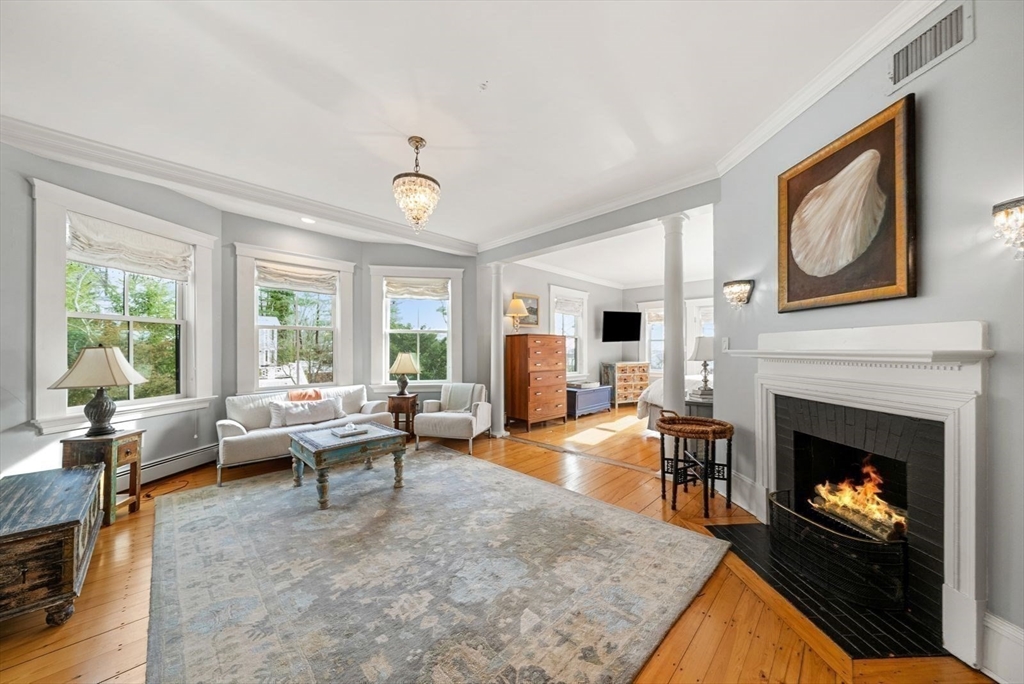 468 Summer Street Manchester, MA 01944 - Photo 22 of 36 a living room with furniture and a fireplace
