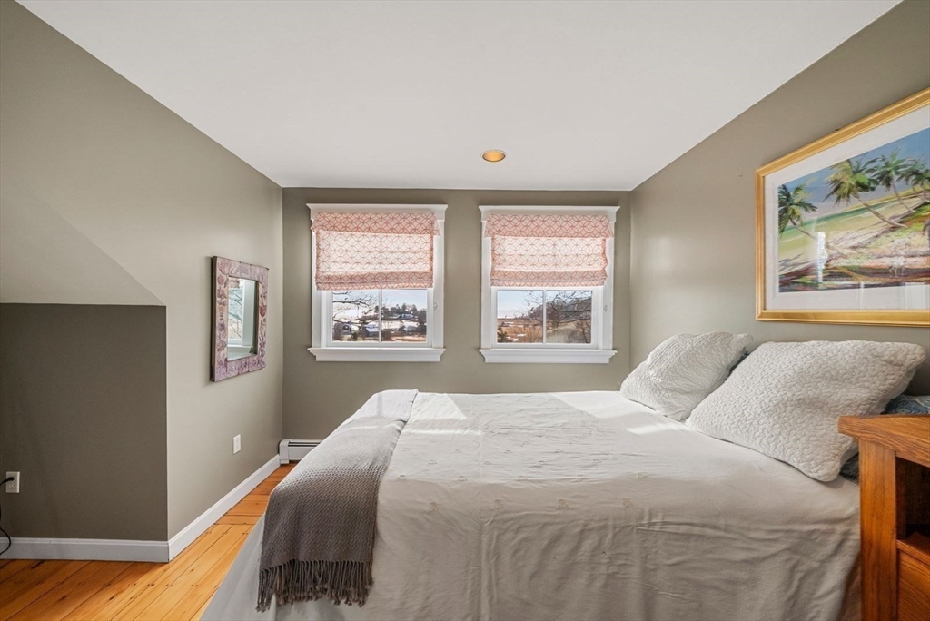 468 Summer Street Manchester, MA 01944 - Photo 27 of 36 a bedroom with a large bed and a window