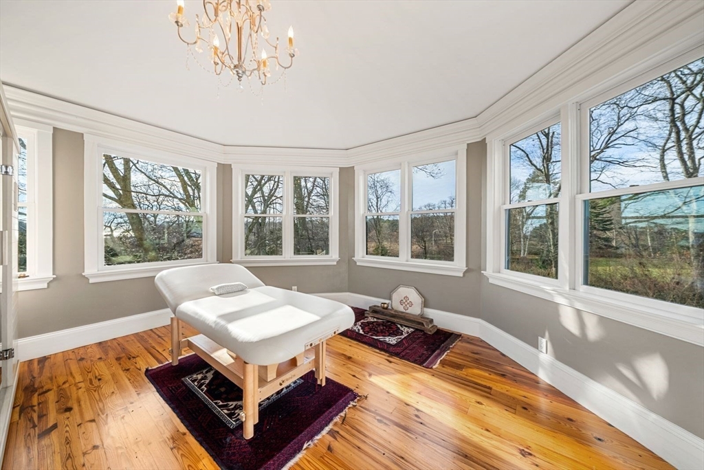 468 Summer Street Manchester, MA 01944 - Photo 30 of 36 a living room with a bed furniture and a large window