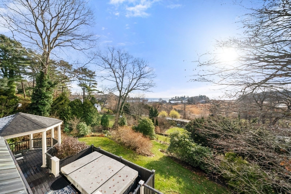468 Summer Street Manchester, MA 01944 - Photo 36 of 36 a view of a terrace with a yard and mountain