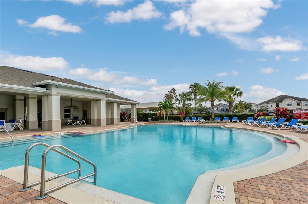 6458 South Goldenrod Road, Unit 29B Orlando, FL 32822 - Photo 36 of 40 a view of a swimming pool with a lounge chairs