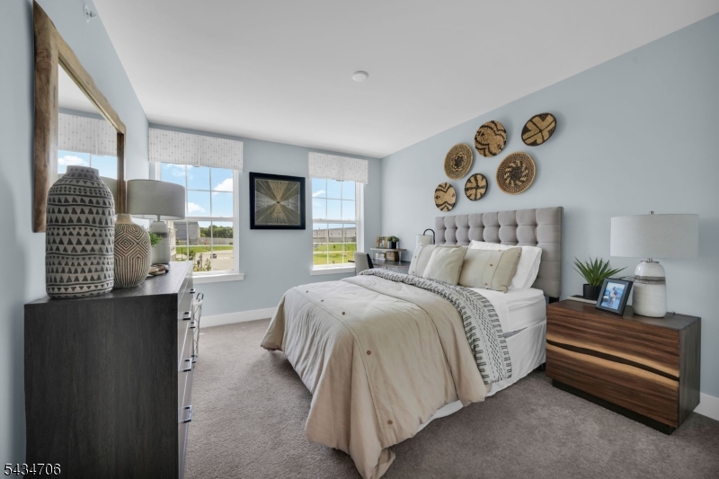 2 Doherty Way Morris Plains, NJ 07950 - Photo 24 of 33 a spacious bedroom with a bed and wooden floor
