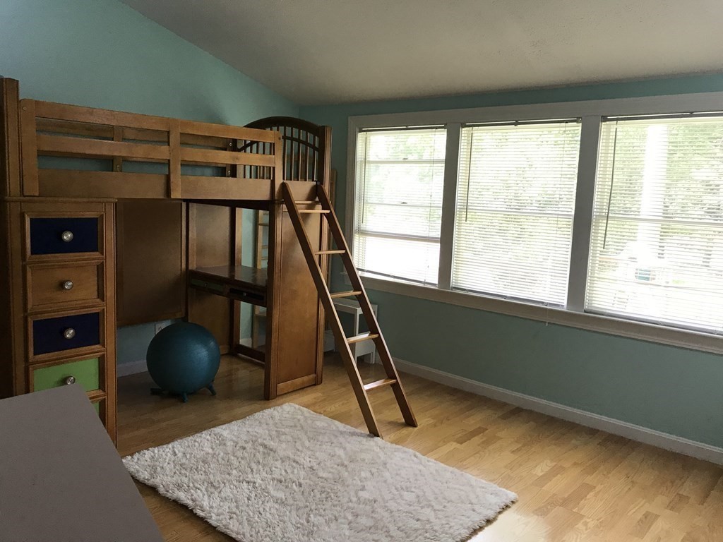 6 Braemore Road Natick, MA 01760 - Photo 21 of 27 a room with gym equipment and a window