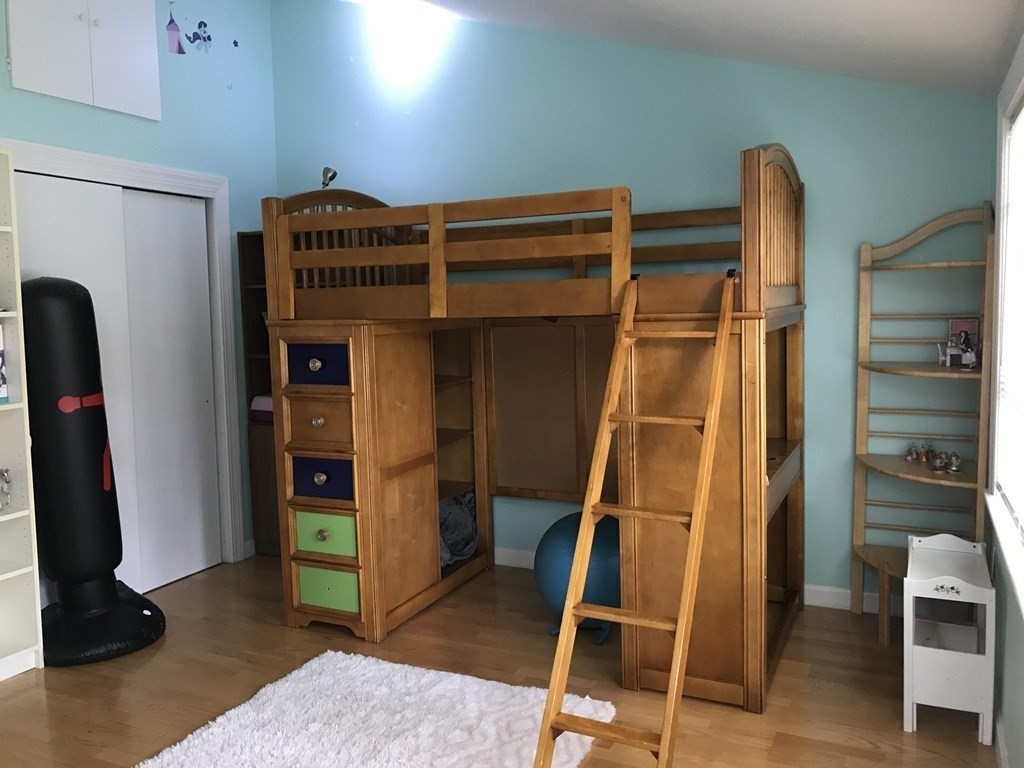 6 Braemore Road Natick, MA 01760 - Photo 22 of 27 a room with furniture and wooden floor
