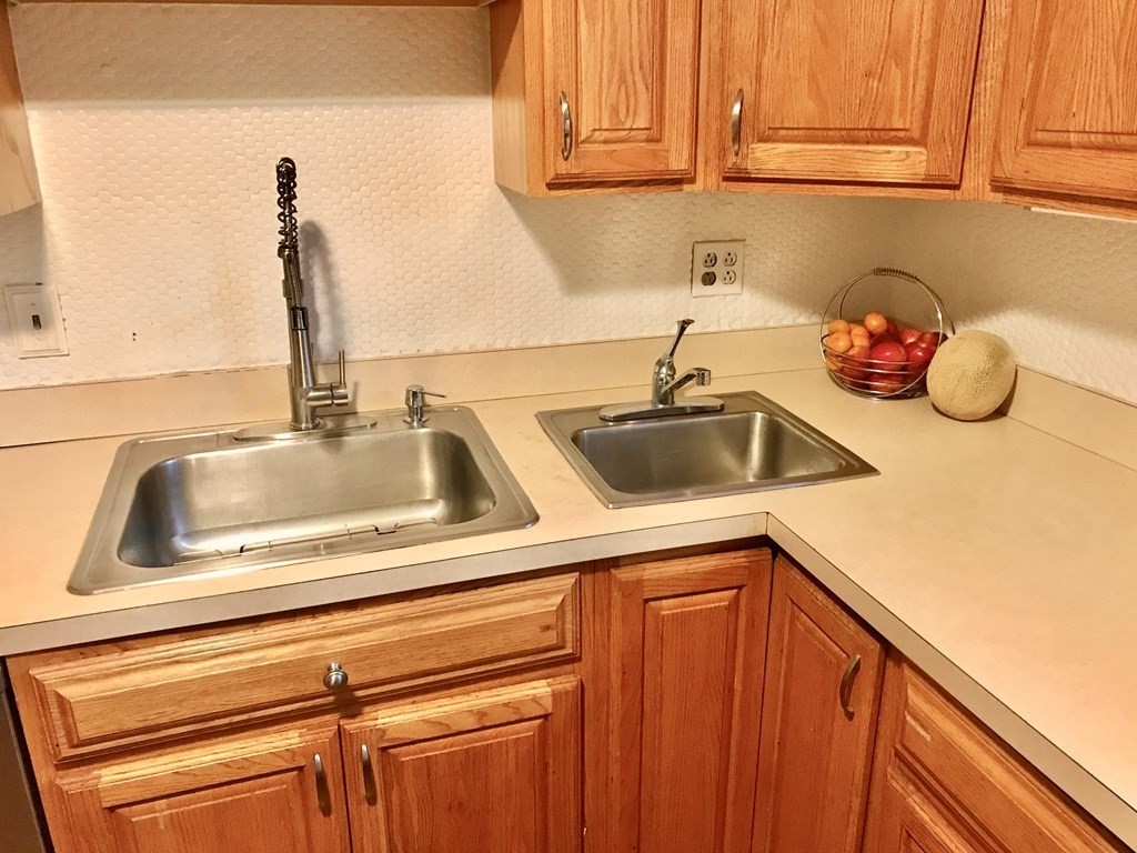 6 Braemore Road Natick, MA 01760 - Photo 4 of 27 a kitchen with a sink and cabinets