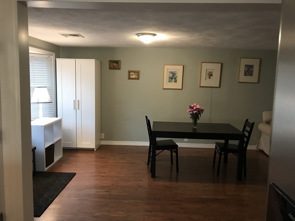 6 Braemore Road Natick, MA 01760 - Photo 6 of 27 a view of a dining room with furniture and wooden floor