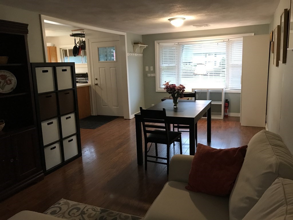 6 Braemore Road Natick, MA 01760 - Photo 8 of 27 a view of a livingroom with furniture and a window