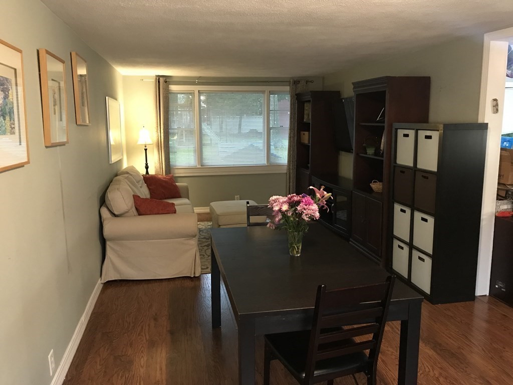 6 Braemore Road Natick, MA 01760 - Photo 9 of 27 a dining room with furniture and wooden floor