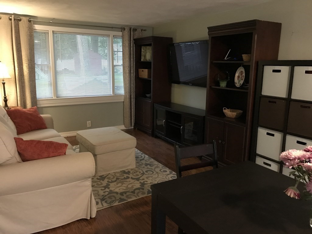 6 Braemore Road Natick, MA 01760 - Photo 10 of 27 a living room with furniture and a window