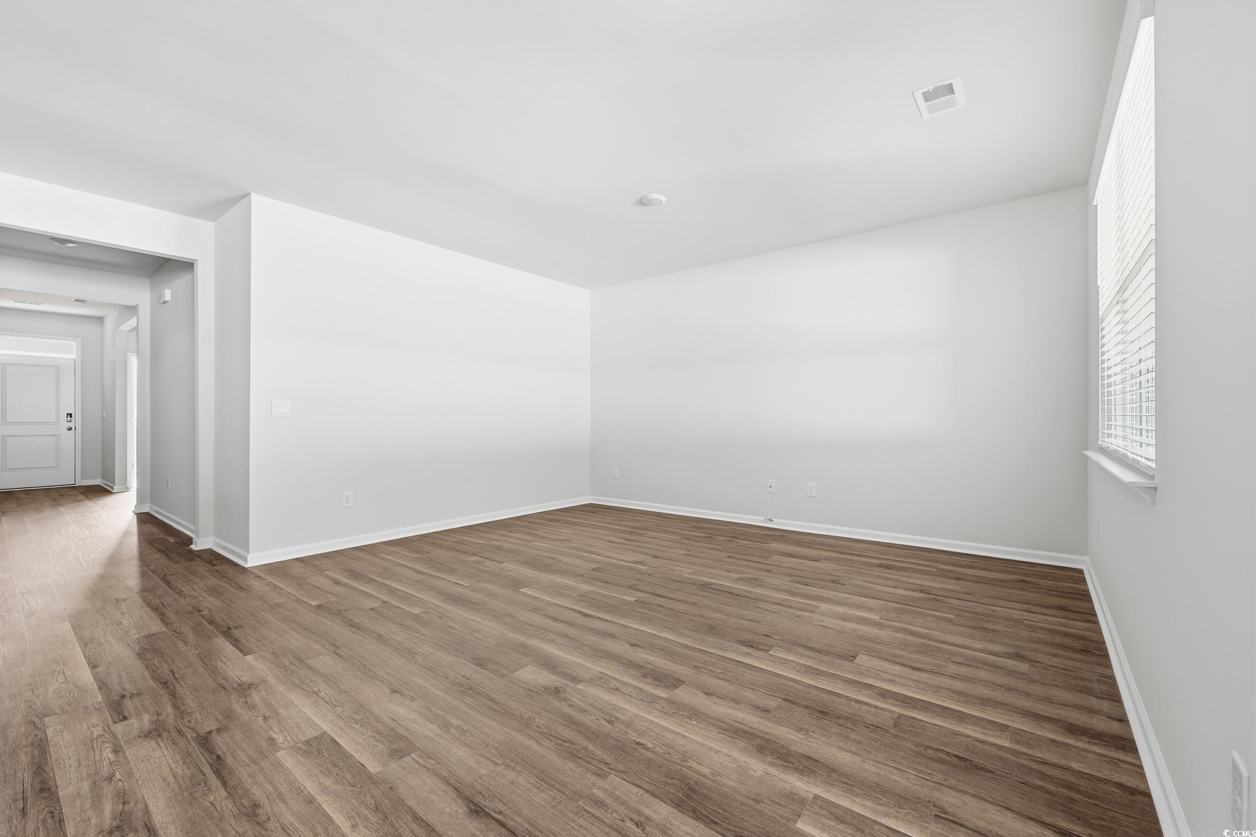 270 Columbus Street Conway, SC 29526 - Photo 12 of 38 Unfurnished room with wood finished floors and baseboards