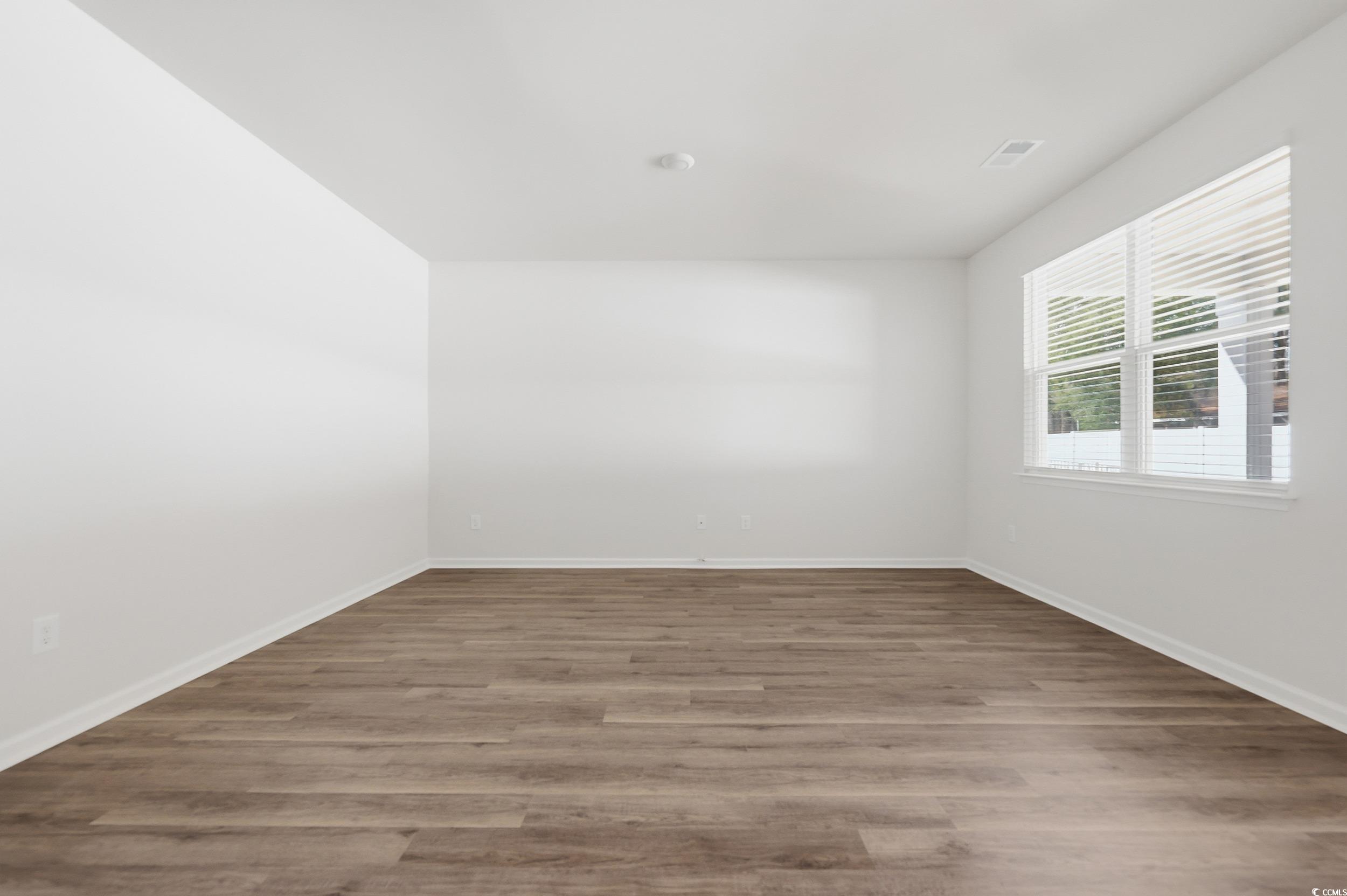 270 Columbus Street Conway, SC 29526 - Photo 13 of 38 Empty room featuring wood finished floors and baseboards