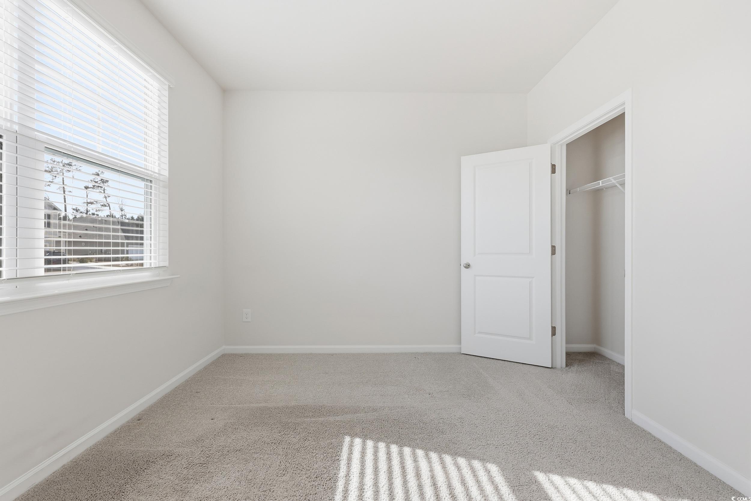 270 Columbus Street Conway, SC 29526 - Photo 15 of 38 Unfurnished bedroom featuring light carpet and a closet