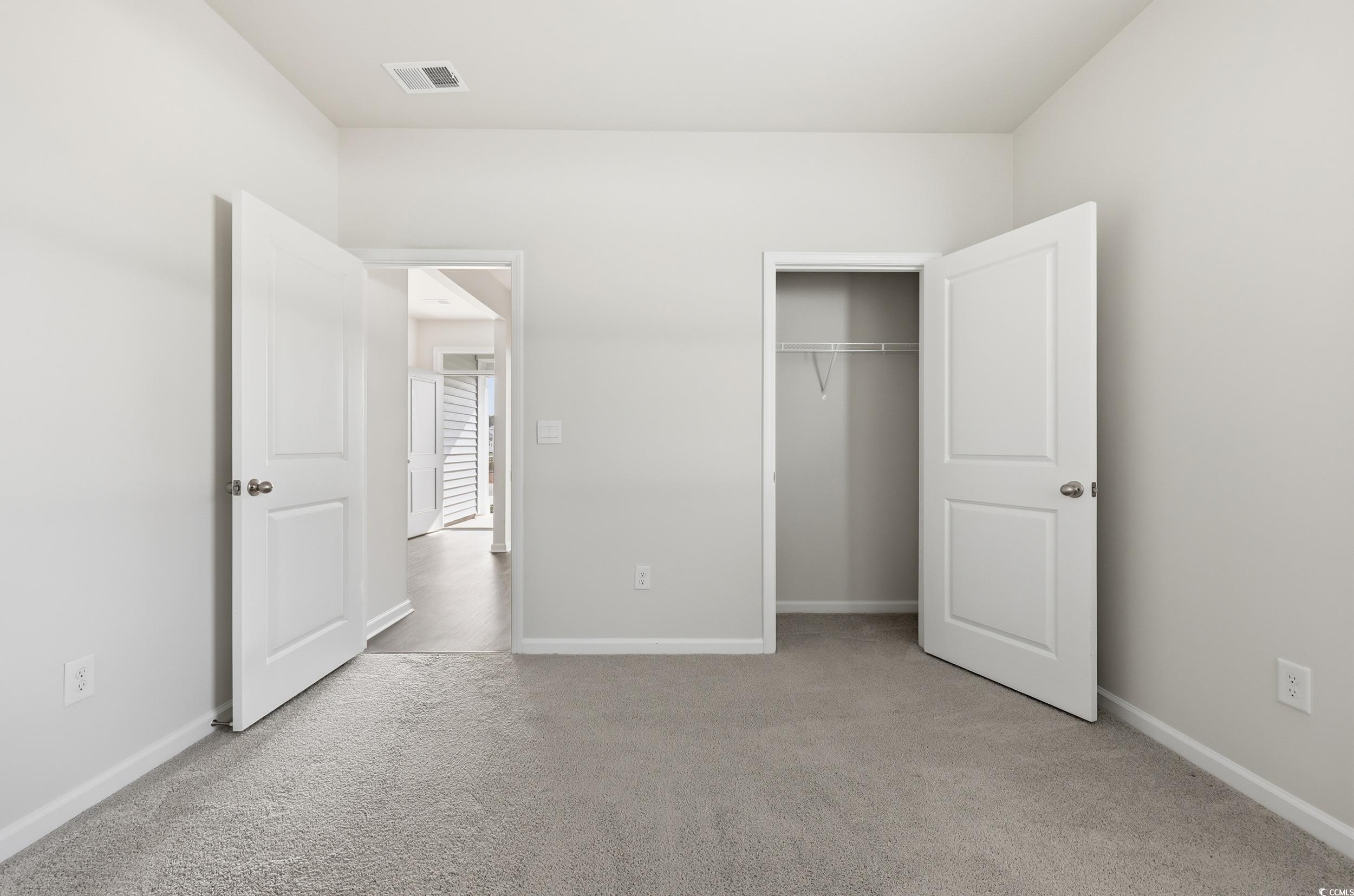 270 Columbus Street Conway, SC 29526 - Photo 19 of 38 Unfurnished bedroom featuring light carpet and a closet