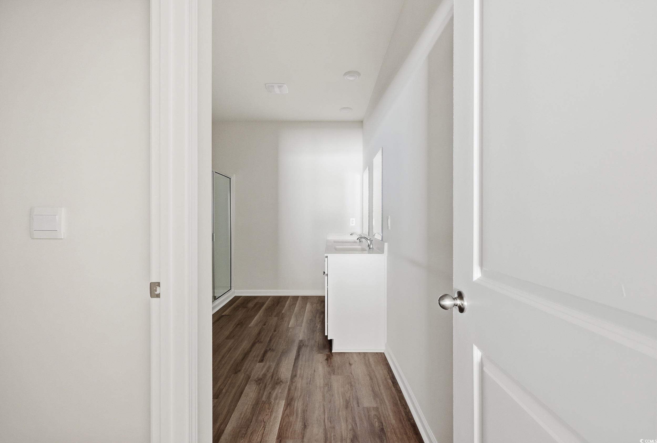 270 Columbus Street Conway, SC 29526 - Photo 22 of 38 Hallway with dark wood-style flooring and baseboards