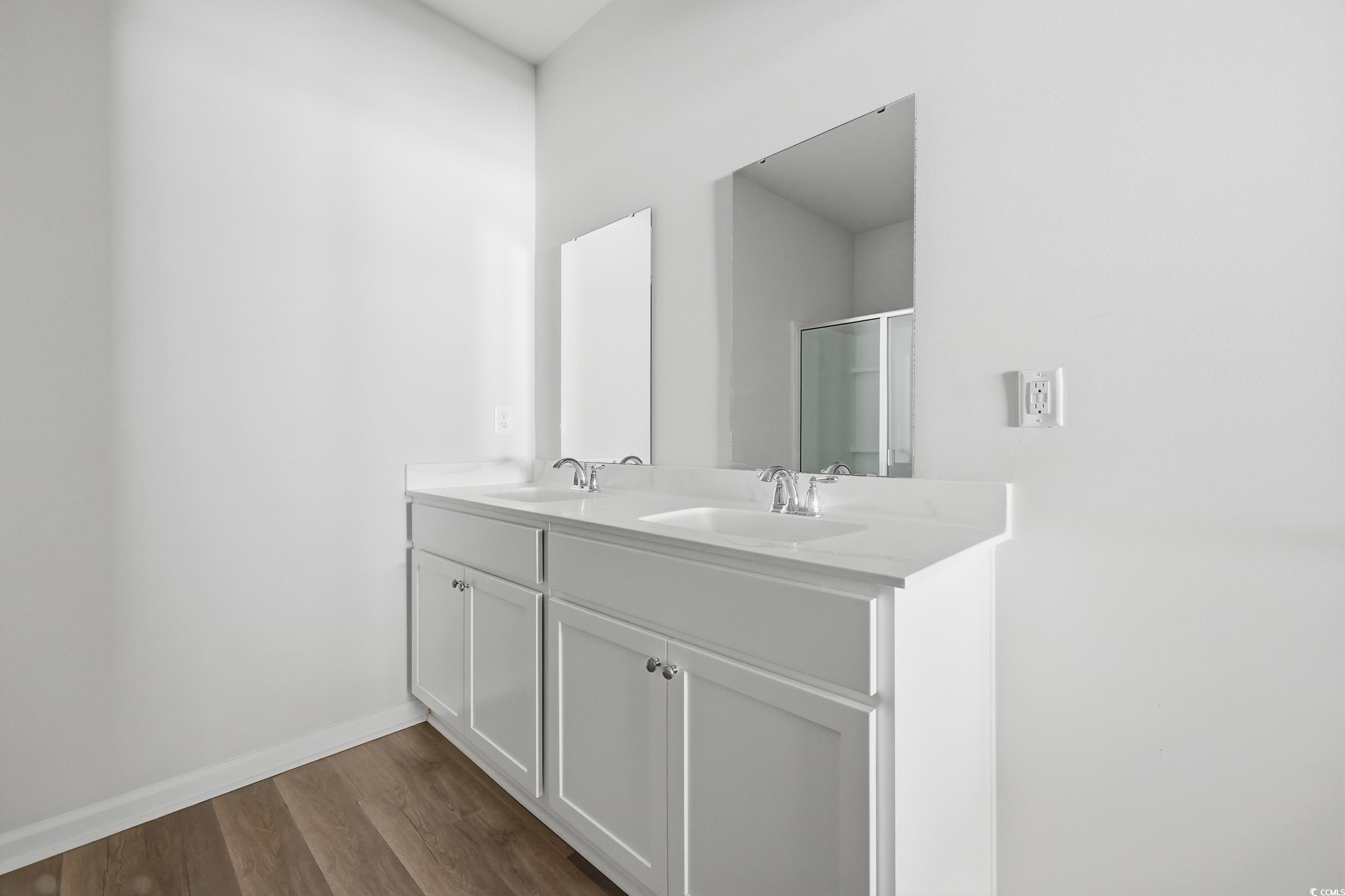 270 Columbus Street Conway, SC 29526 - Photo 24 of 38 Full bathroom featuring a shower stall, double vanity, and dark wood-style flooring
